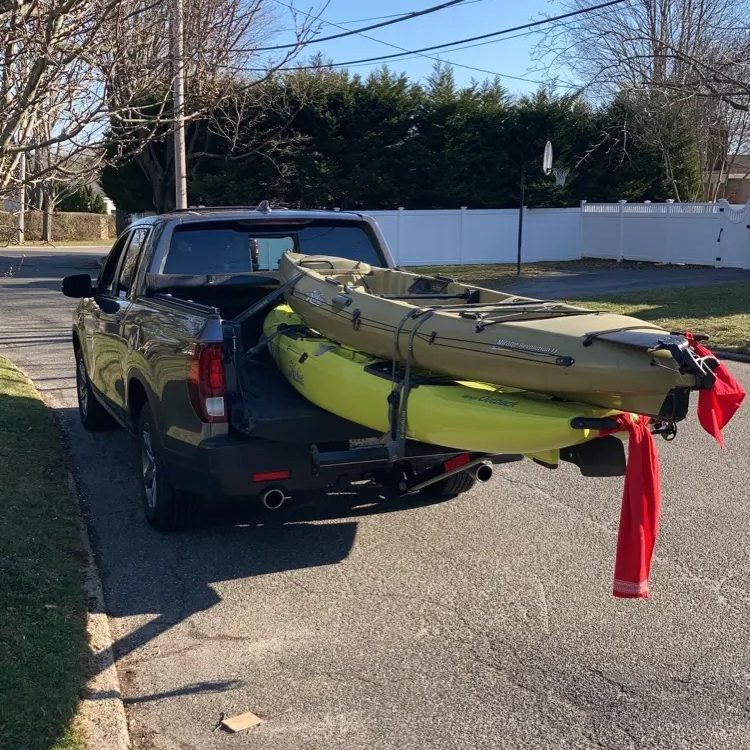 Honda Ridgeline with kayak rack on a beach carrying a Hobie Outback in Montauk